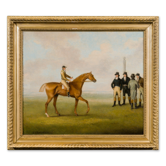 Racing Scene – A Racehorse with Jockey up approaching a group of gentlemen Image 1